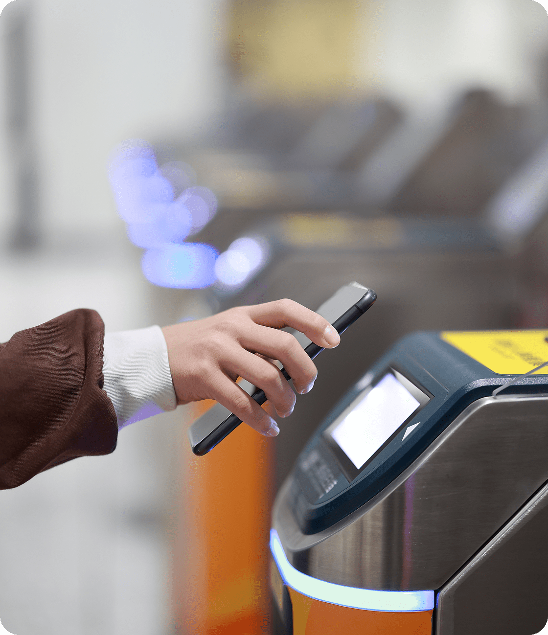 Hand using smartphone for contactless payment