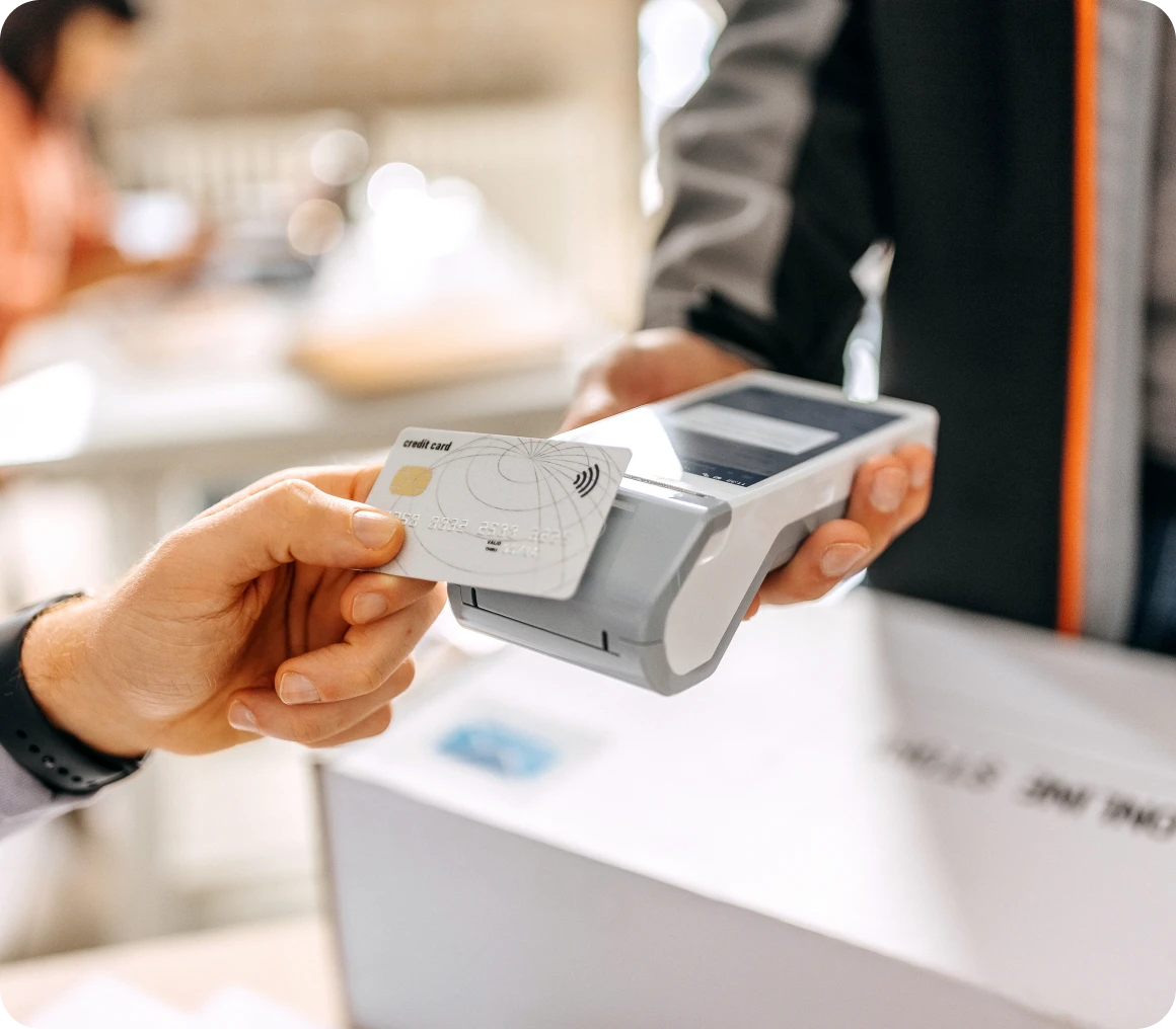 Person using card reader for payment